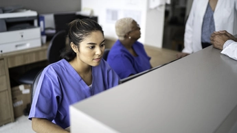 Secretary working at hospital reception