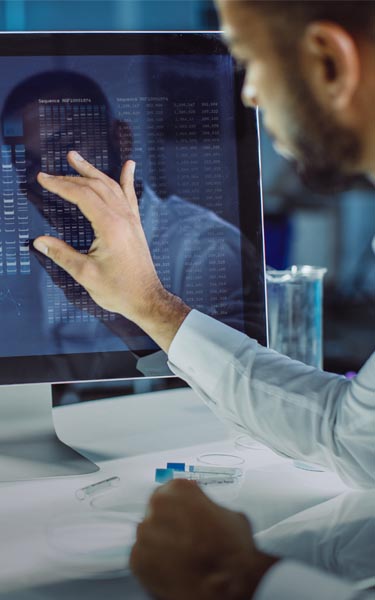 man observing data on computer screen