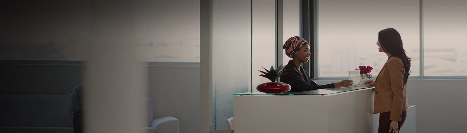 female executive at office reception counter