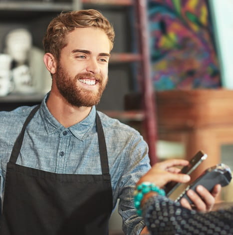 retail location employee using mobile payment