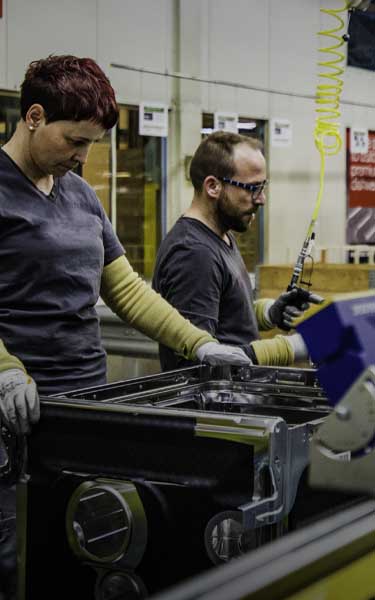 two employees working in manufacturing plant