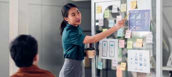 Woman Pointing at Board