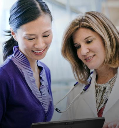 doctor and patient reviewing the results on tablet