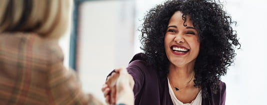 Happy woman shaking hand