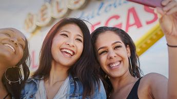 three girls taking selfie