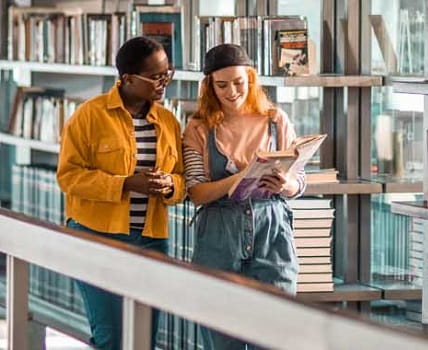 students walking in library