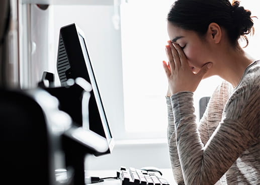 Anxious woman at computer