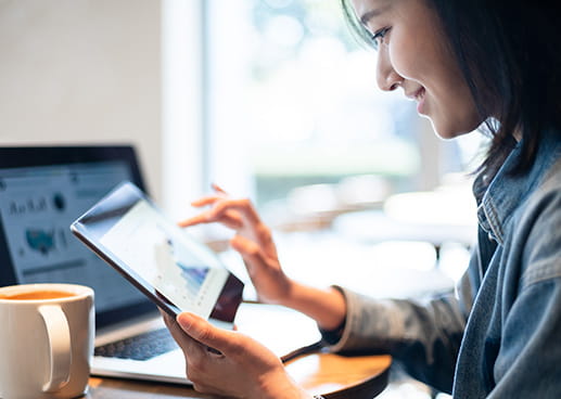 Woman with tablet and notebook PC