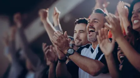 fans clapping at an sporting event