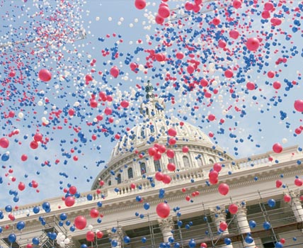 Top of a building with ballons