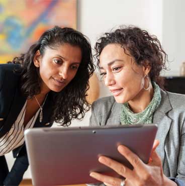 two business women with tablet