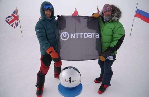 Robert and Barney Swan holding flag at the pole