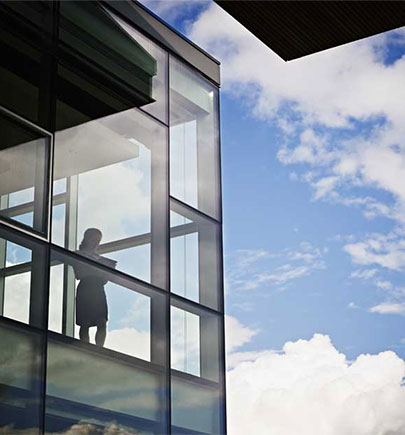 Businesswoman near windows in conference room