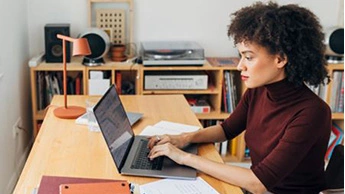 woman working on laptop at home