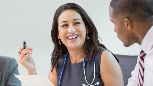 smiling female doctor with executive