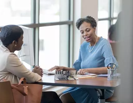 Loan officer reviews woman's loan application