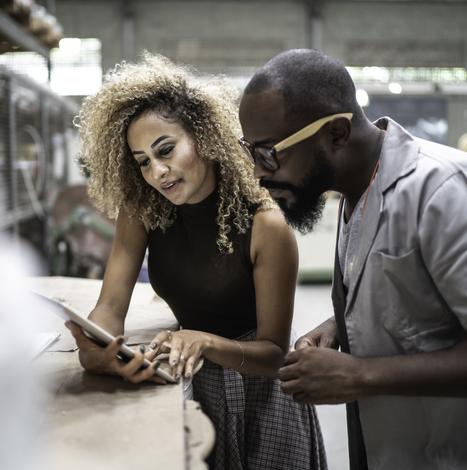 two people reviewing tablet