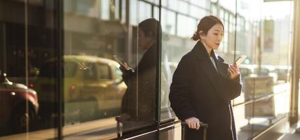 woman looking at mobile phone