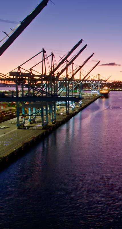 shipping boats at dock with sunset background