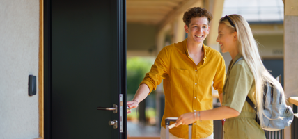 couple checking into hotel room