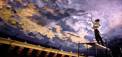 man painting mural on ceiling low angle view