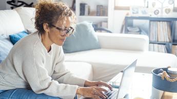 woman working on laptop at home