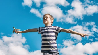 Boy plays the pilot of the aircraft