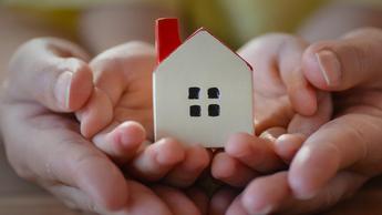 small house model on kids palm