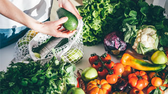 hands holding fruits and vegetables