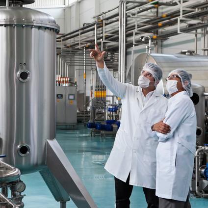 two men standing in a lab