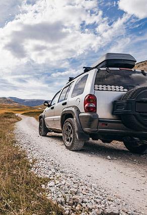 car with mountains ahead