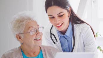 doctor and patient reviewing medical documents