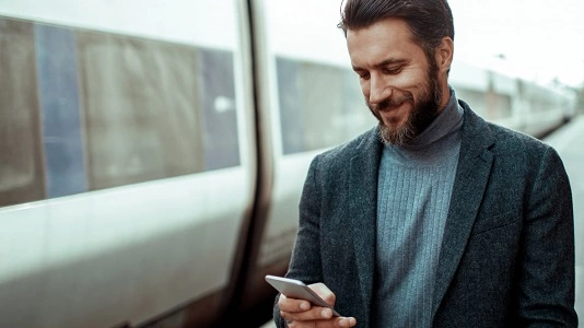 man looking at mobile device